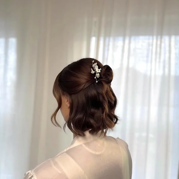 Half-Up Bun with Floral Pin for Short Hair